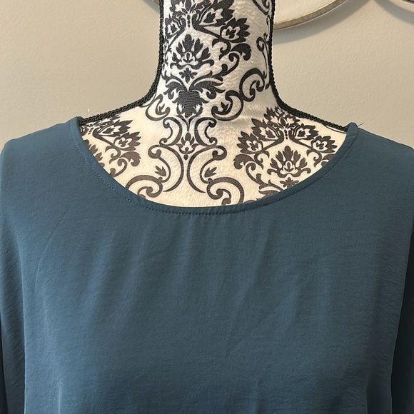 NWOT. Woman’s round neckline blouse with 3/4 length sleeves & ruffle hemline. - Picture 3 of 10